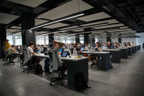 Office workers working in a big open plan office space