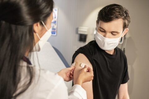Young man getting vaccinated