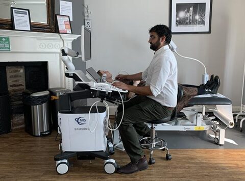 Sonographer Performing An Ultrasound Scan at Stonegate Medical Clinic